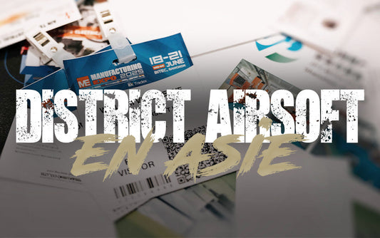 Visitor badges and passes for manufacturing expo 2025 displayed on a table at district airsoft enasie event