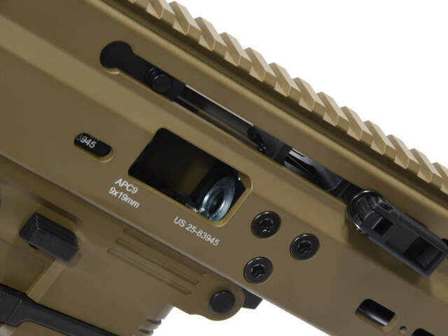 Close-up of ARCHWICK B&T GBBR apc9 tan airsoft showing detailed receiver and rail system