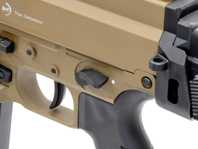 Close-up of ARCHWICK B&T apc9 tan airsoft GBBR trigger and safety selector switch in tan color