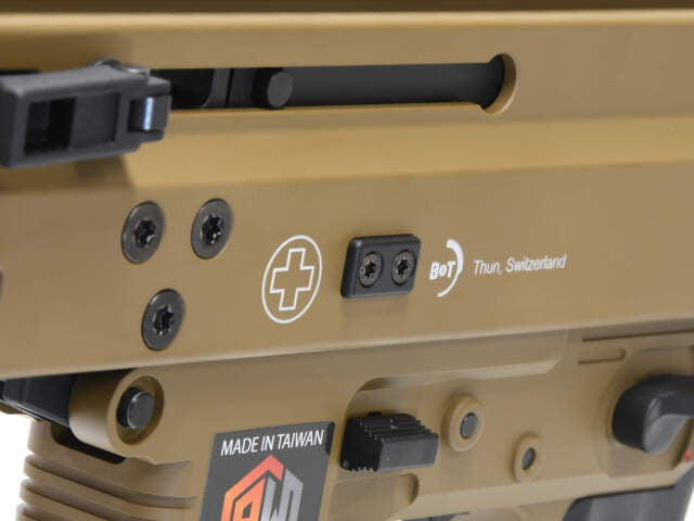 Close-up of archwick b&t gbbR showing details of apc9 tan airsoft with Swiss markings
