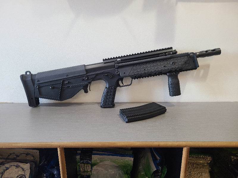 ARES KEL-TEC BULLPUP AEG airsoft rifle in black with detachable magazine on table