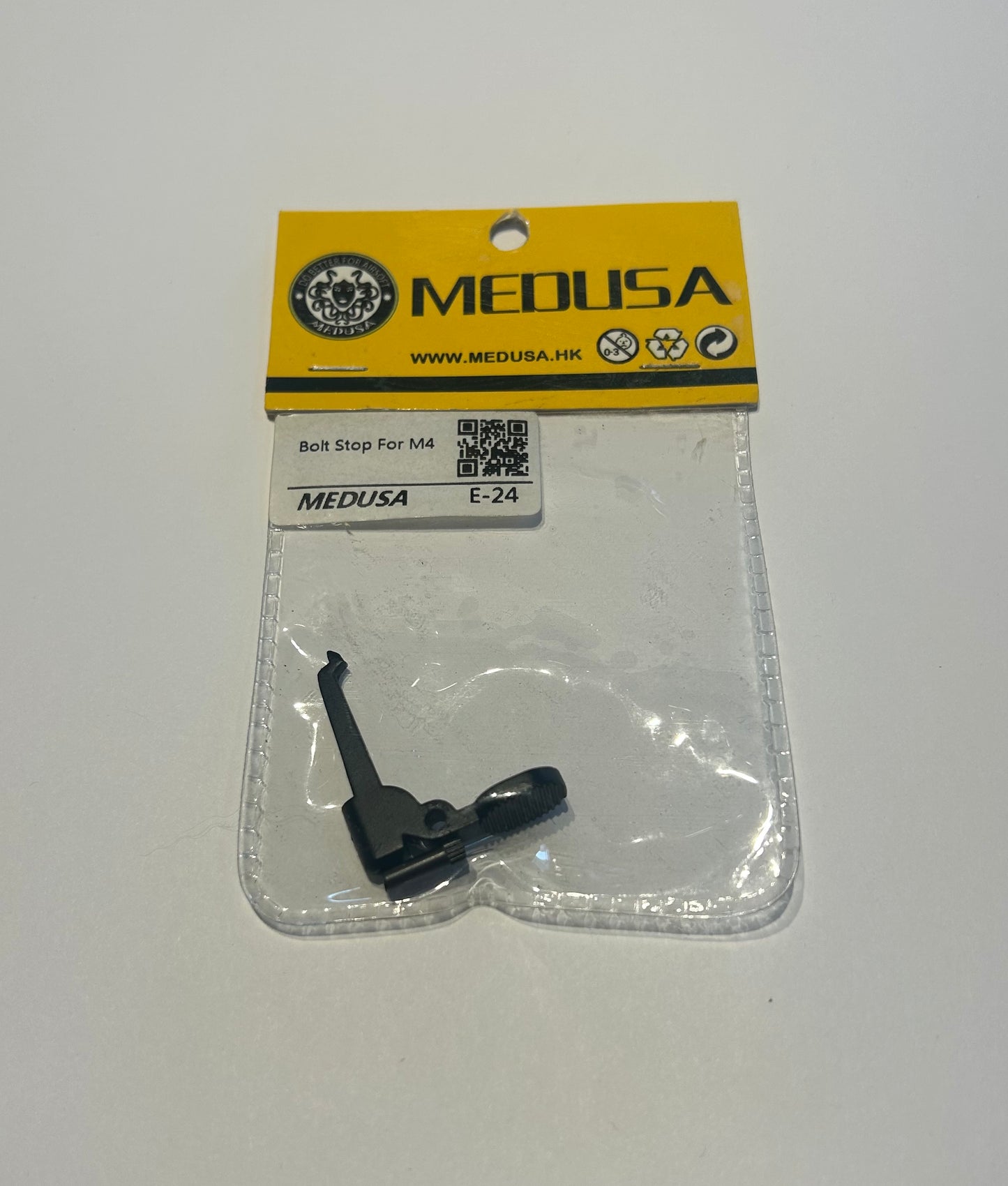 Medusa Bolt Stop m4 airsoft external part in clear plastic packaging with yellow label