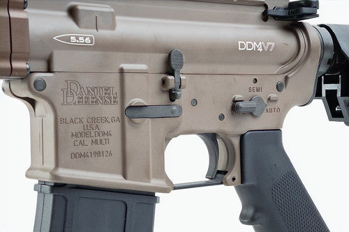 Close-up of a Daniel Defense GBBR airsoft rifle in flat dark earth color with semi-auto and auto settings