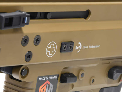 Close-up of archwick b&t gbbR showing details of apc9 tan airsoft with Swiss markings
