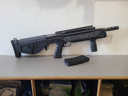 ARES KEL-TEC BULLPUP AEG airsoft rifle in black with detachable magazine on table