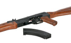 Double Bell AKM airsoft rifle AEG with wooden stock and handguard shown with detached curved magazine