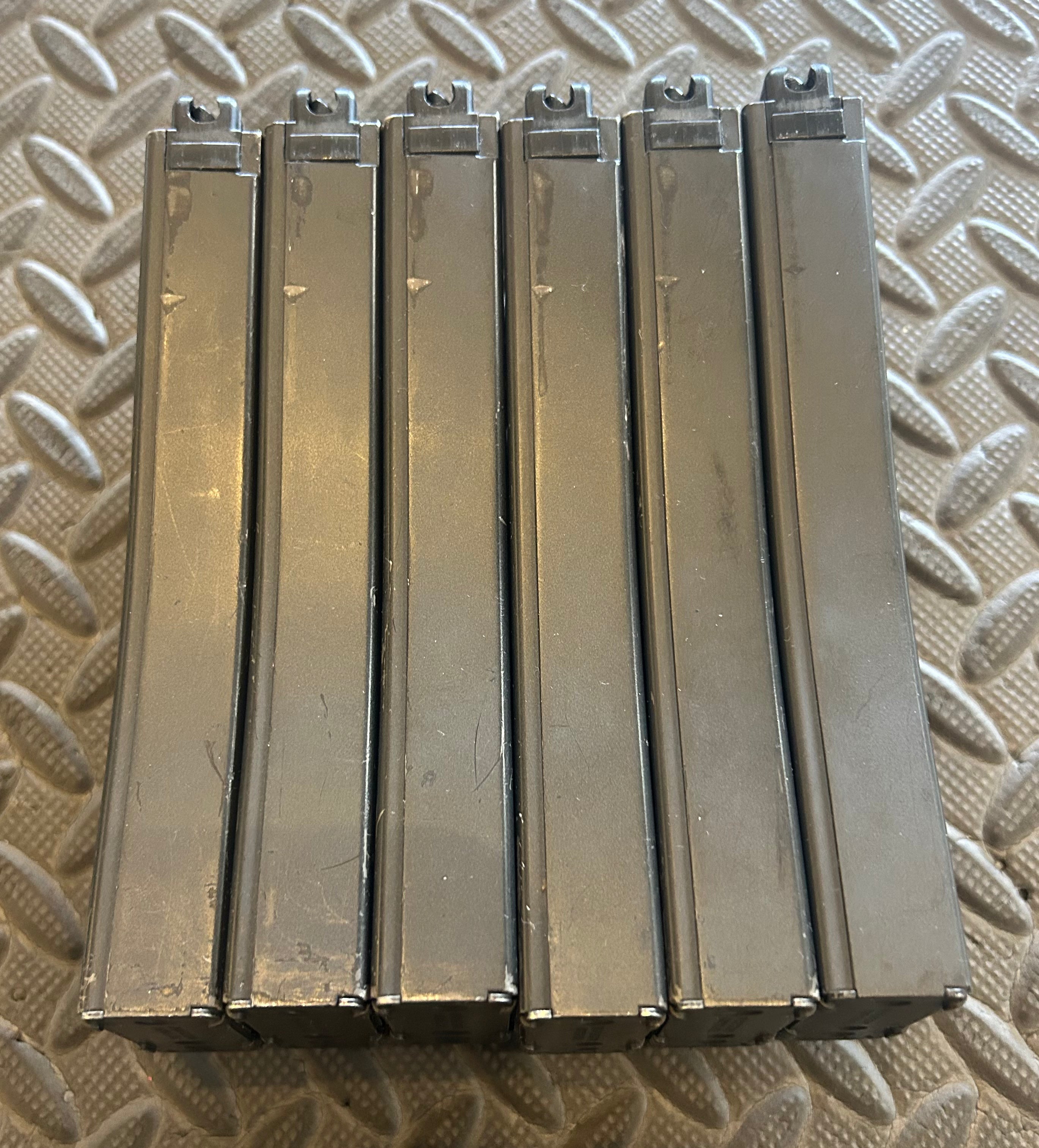 Set of six Tokyo Marui M4 MWS GBBR magazine clips designed for airsoft gameplay