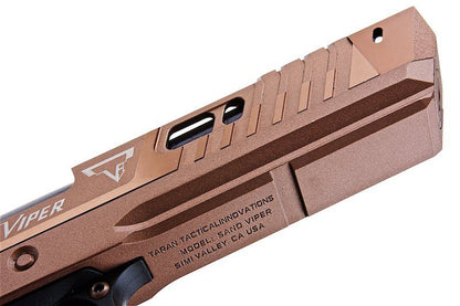Close-up of ARMY ARMAMENT pistol tti sand viper in tan color with detailed engraving